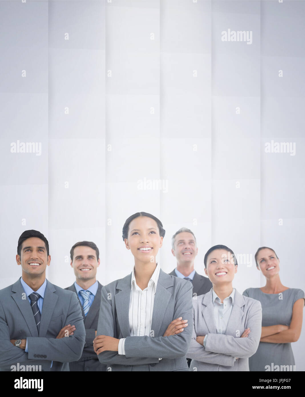 Composite image of business people looking up in office Stock Photo - Alamy