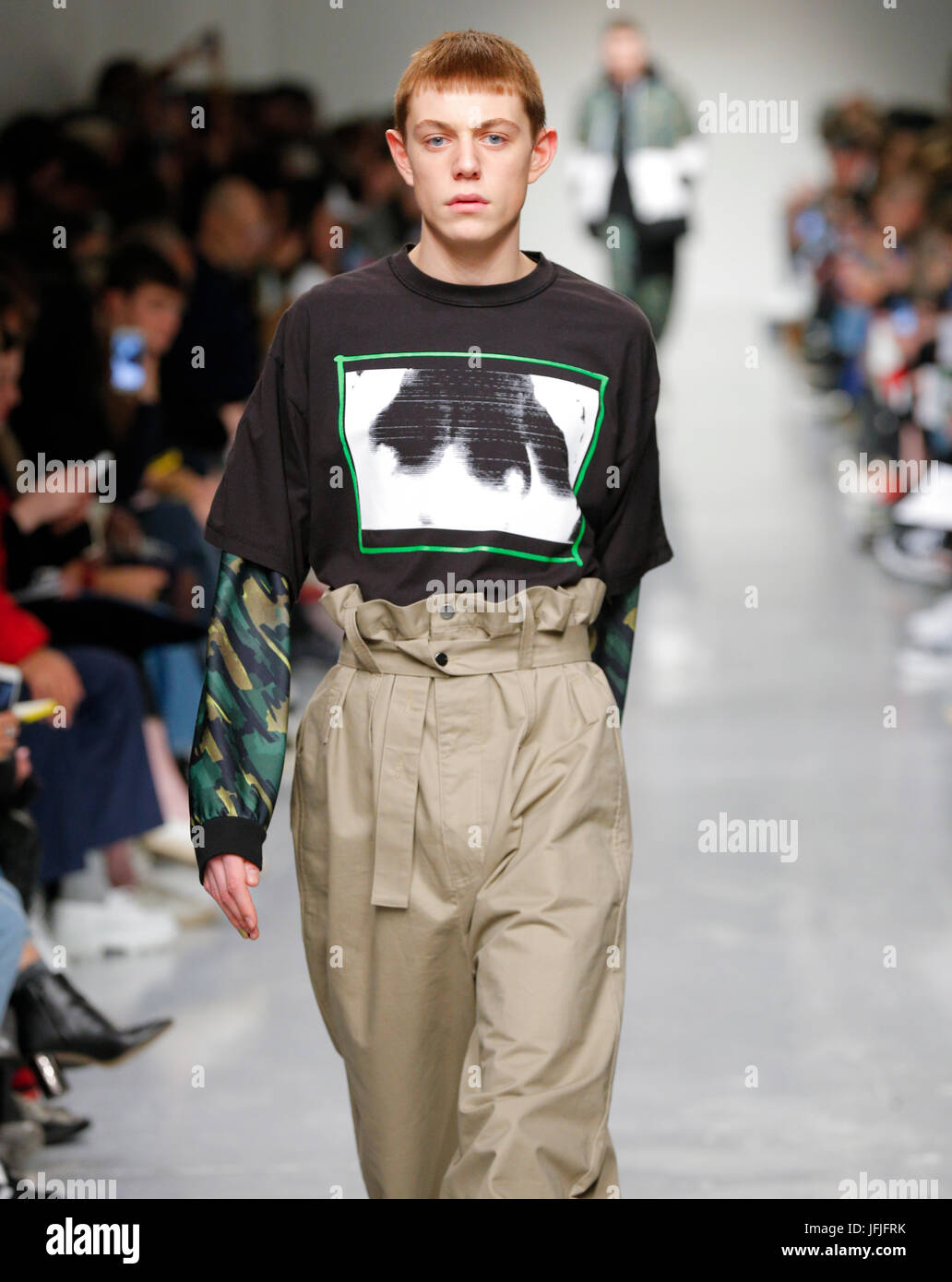 MILAN - SEPTEMBER 21: Elina Halimi with jeans jacket and red Supreme bag  before Fendi fashion show, Milan Fashion Week street style on September 21,  2 Stock Photo - Alamy