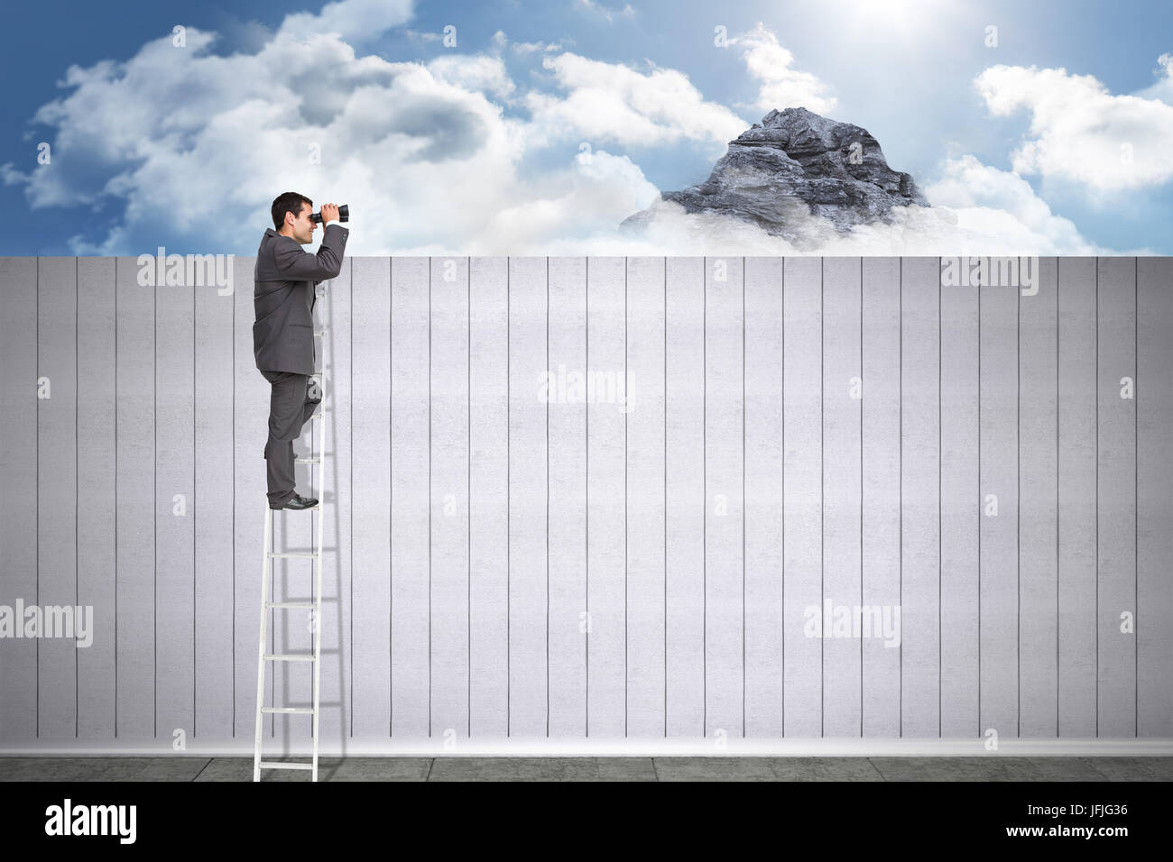 Composite image of businessman standing on ladder using binoculars Stock Photo