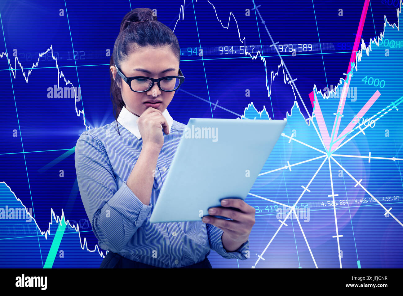 Composite image of asian businesswoman using tablet Stock Photo