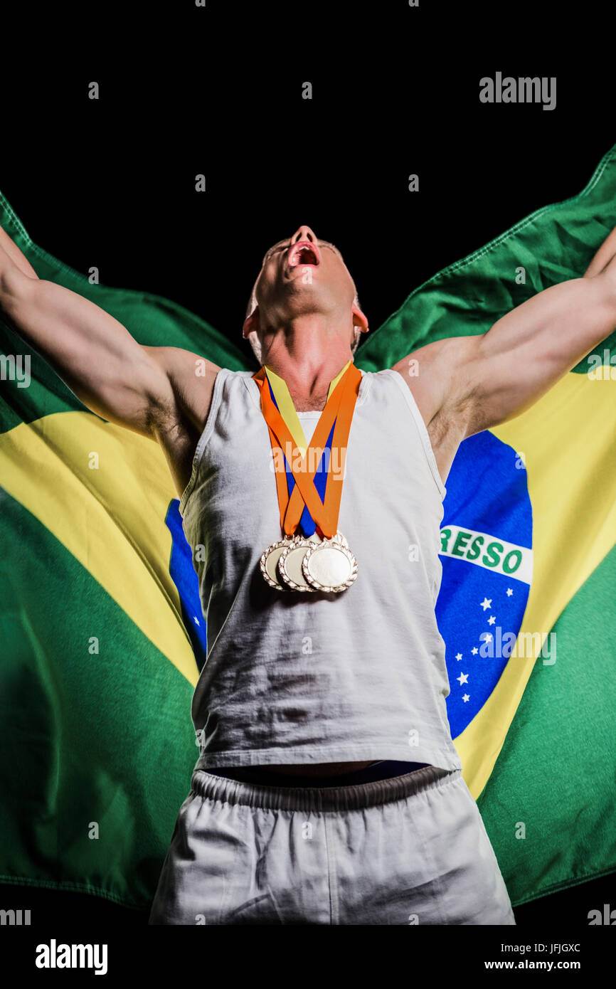 Athlete posing with gold medals after victory Stock Photo - Alamy