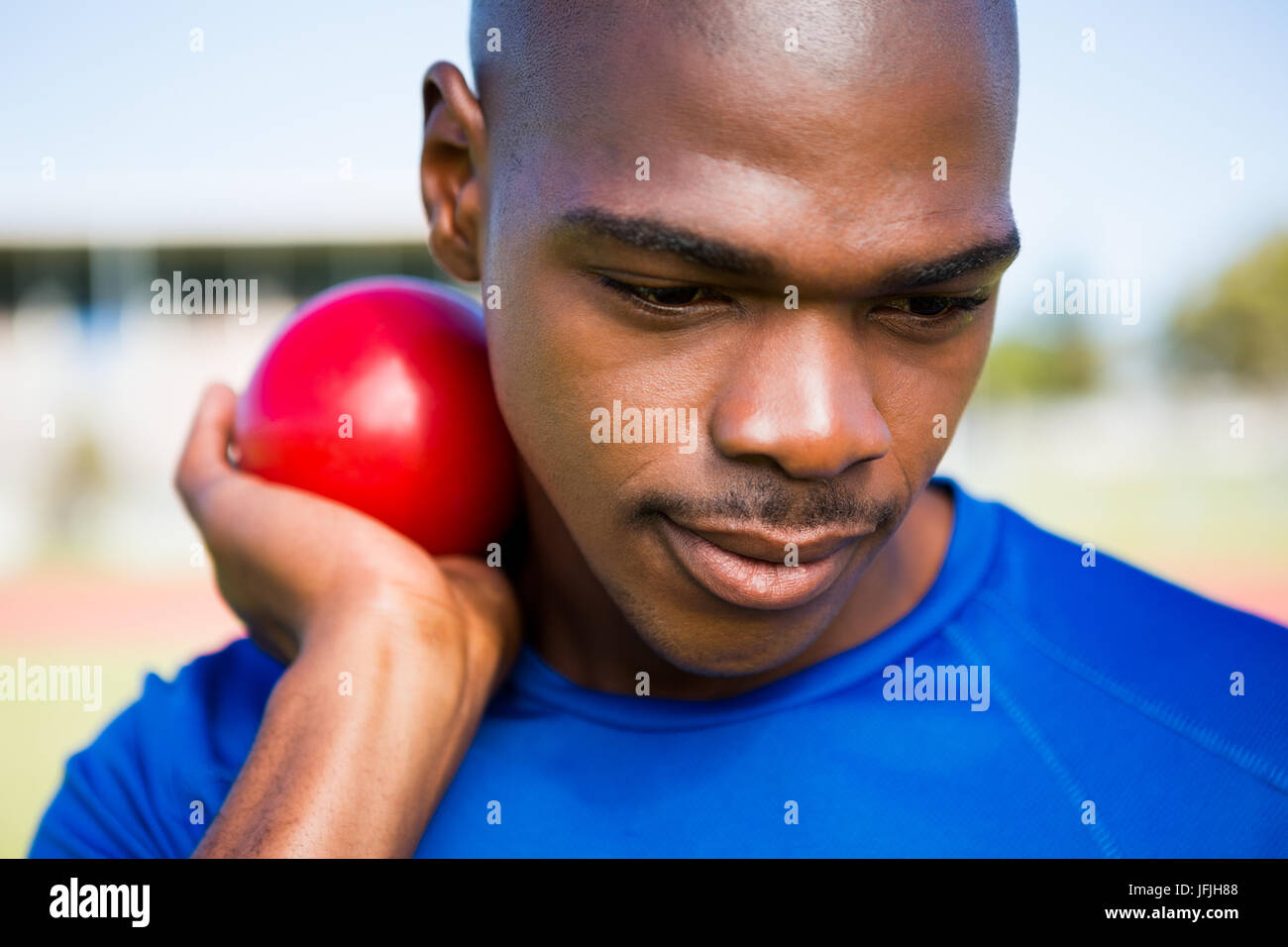 Male athlete preparing to throw shot put ball Stock Photo Alamy