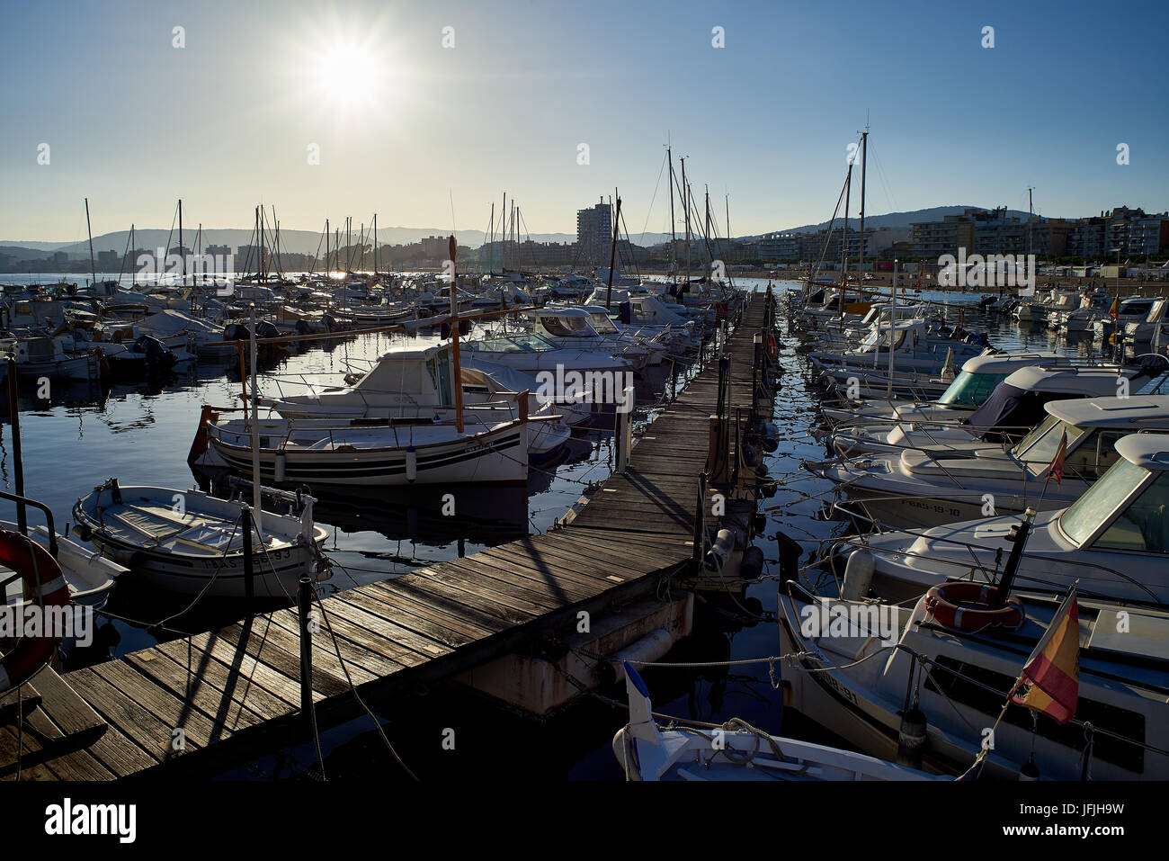 Boats moored in the port of Palamos at sunset. Baix Emporda, Girona, Catalonia, Spain. Stock Photo