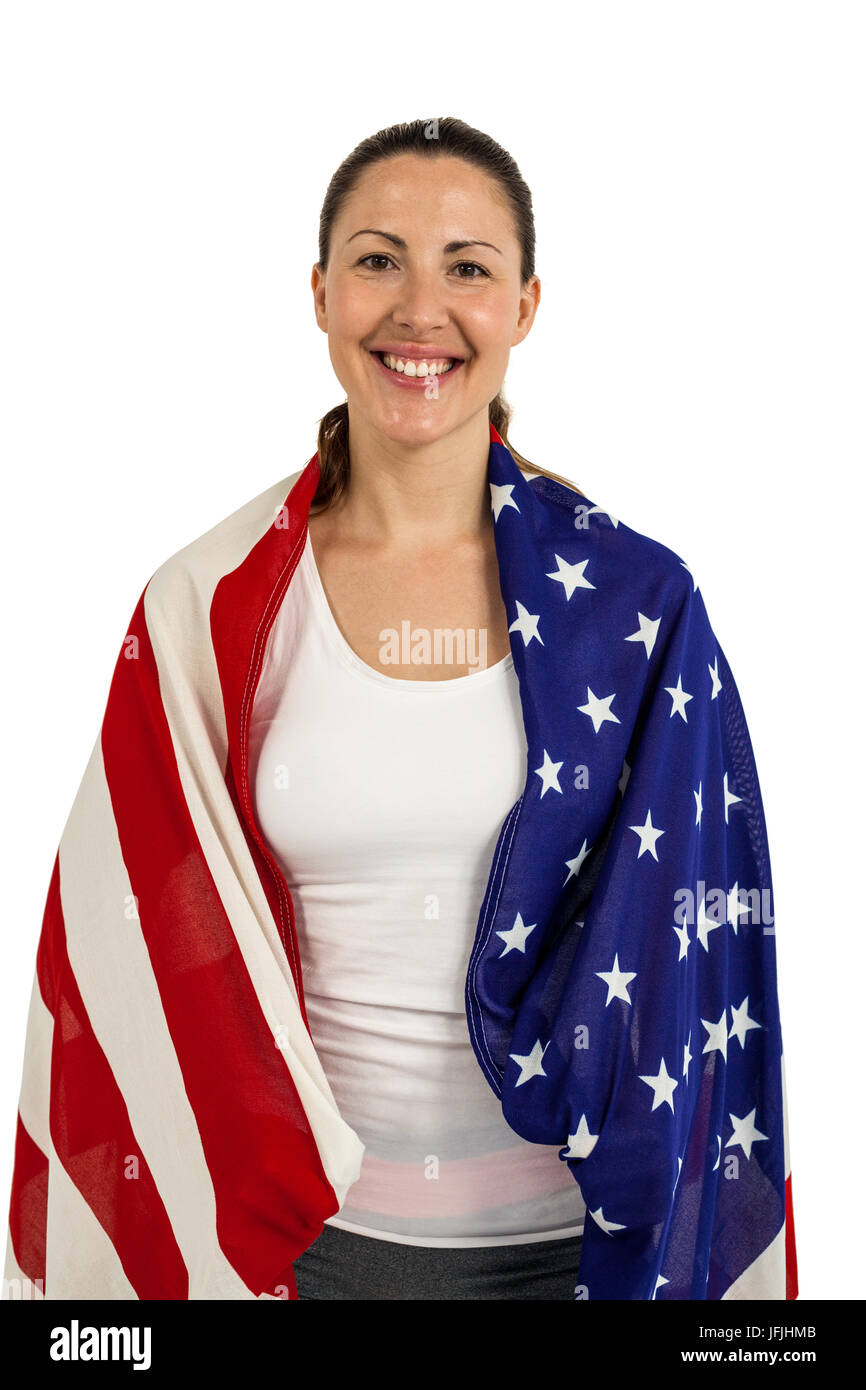 Female athlete with american flag wrapped around his body Stock Photo