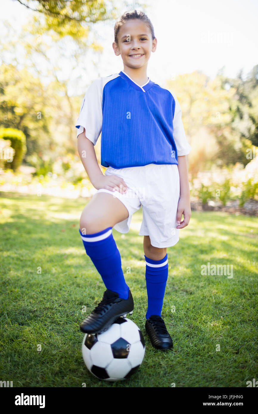 Front view of girl wearing soccer uniform standing Stock Photo - Alamy