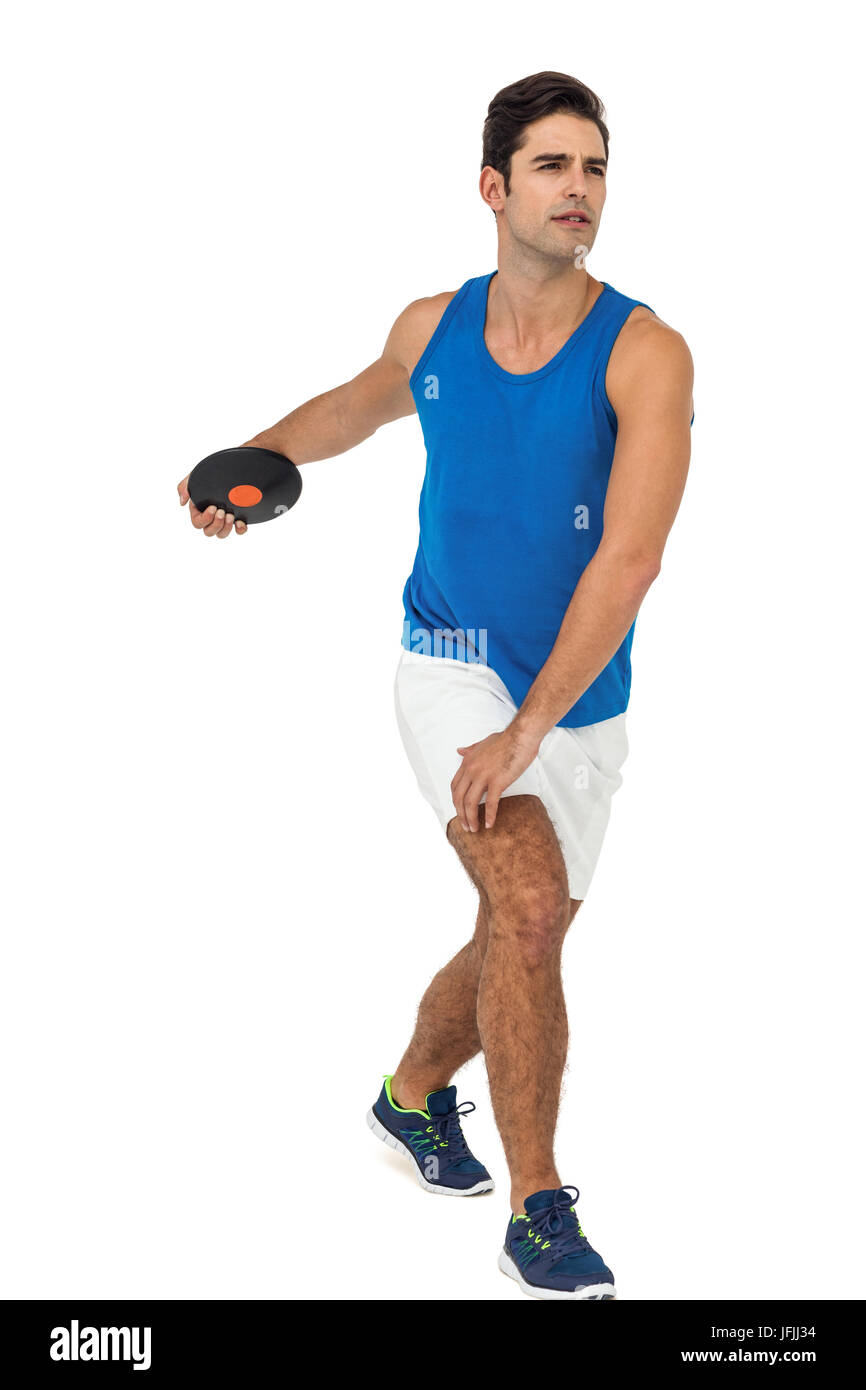 Male athlete playing discus throw on white background Stock Photo Alamy