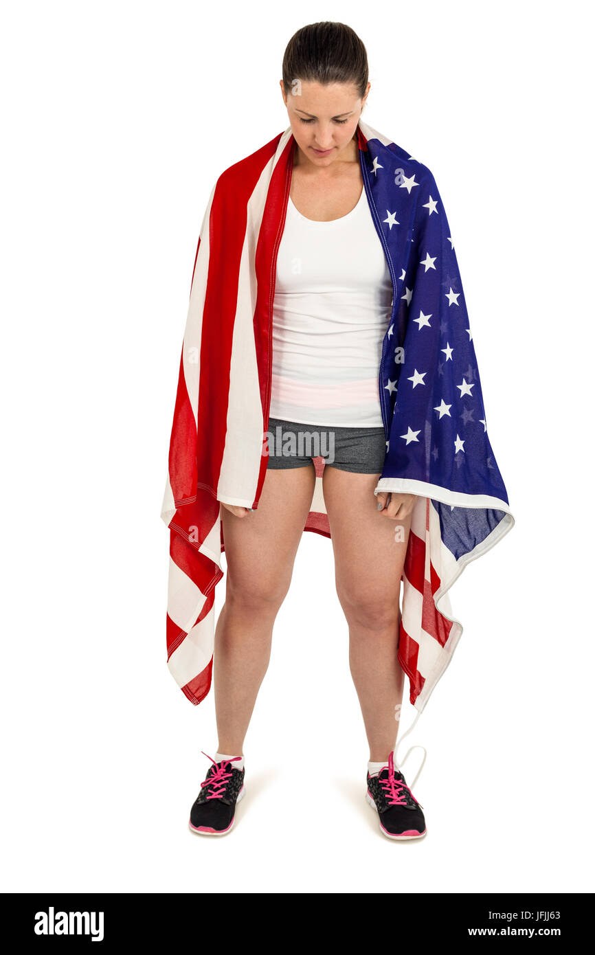 Female athlete with american flag wrapped around her body Stock Photo ...