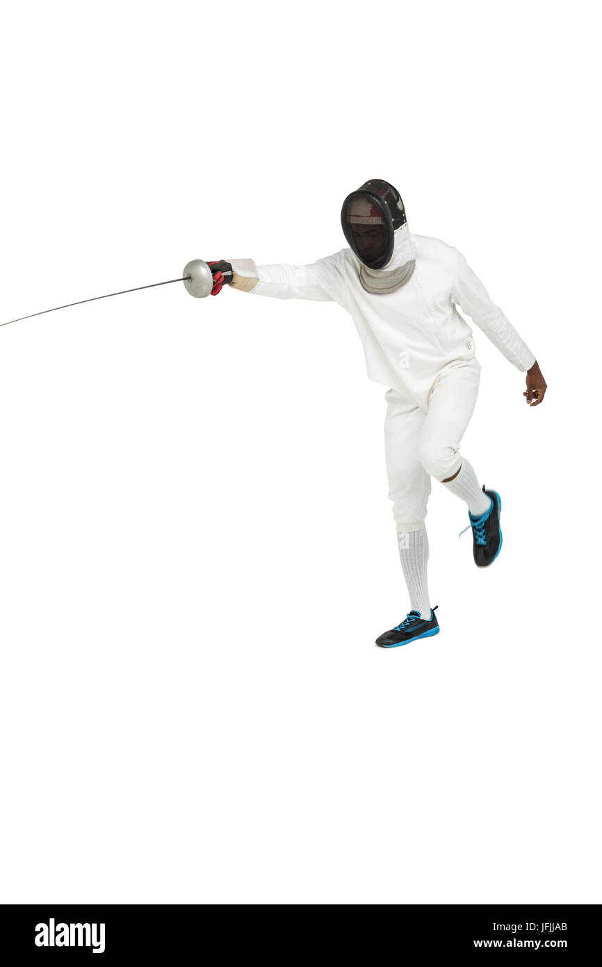 Man wearing fencing suit practicing with sword Stock Photo