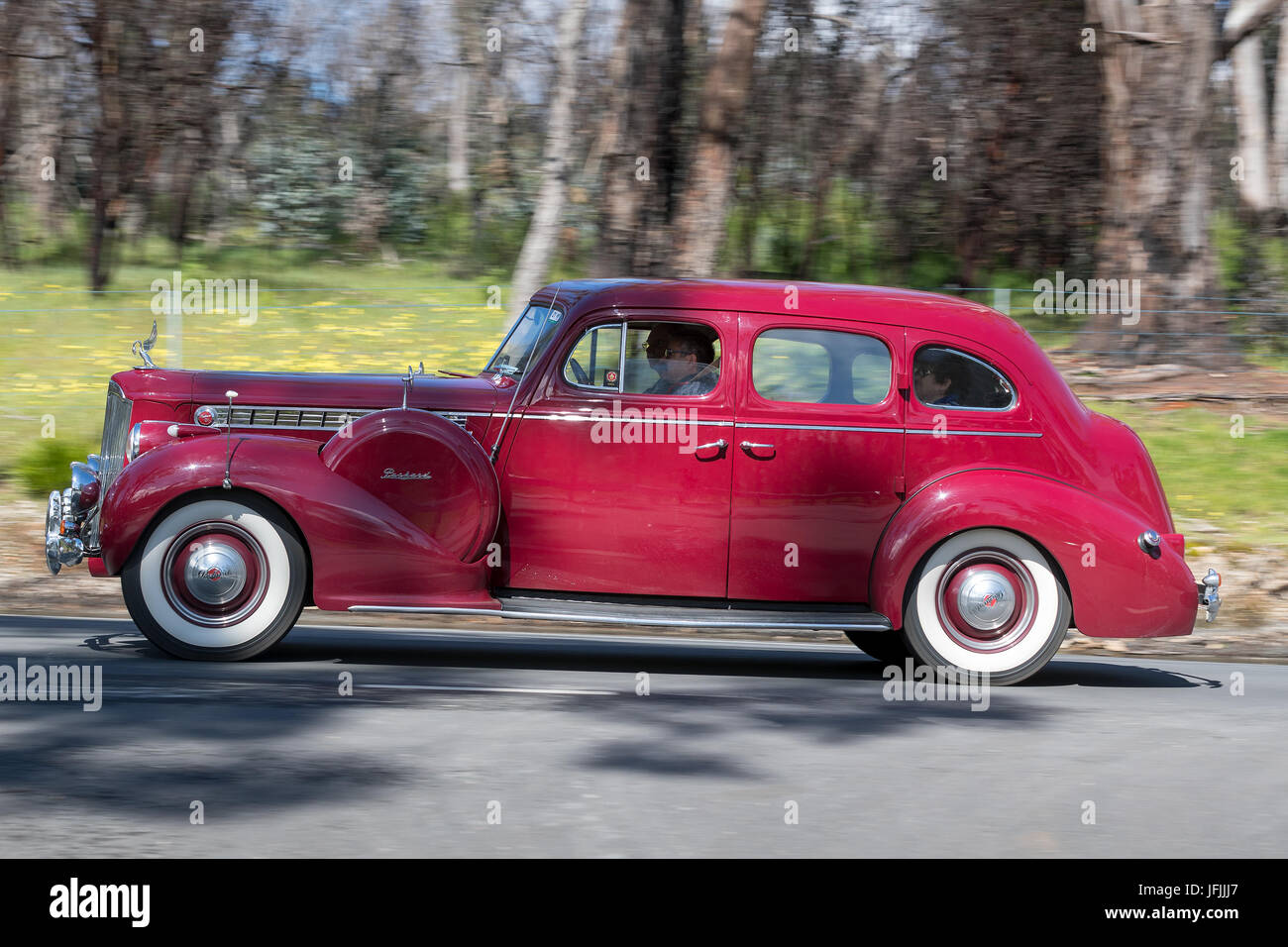 Vintage 1940 Packard 120 Sedan driving on country roads near the town of Birdwood, South Australia. Stock Photo