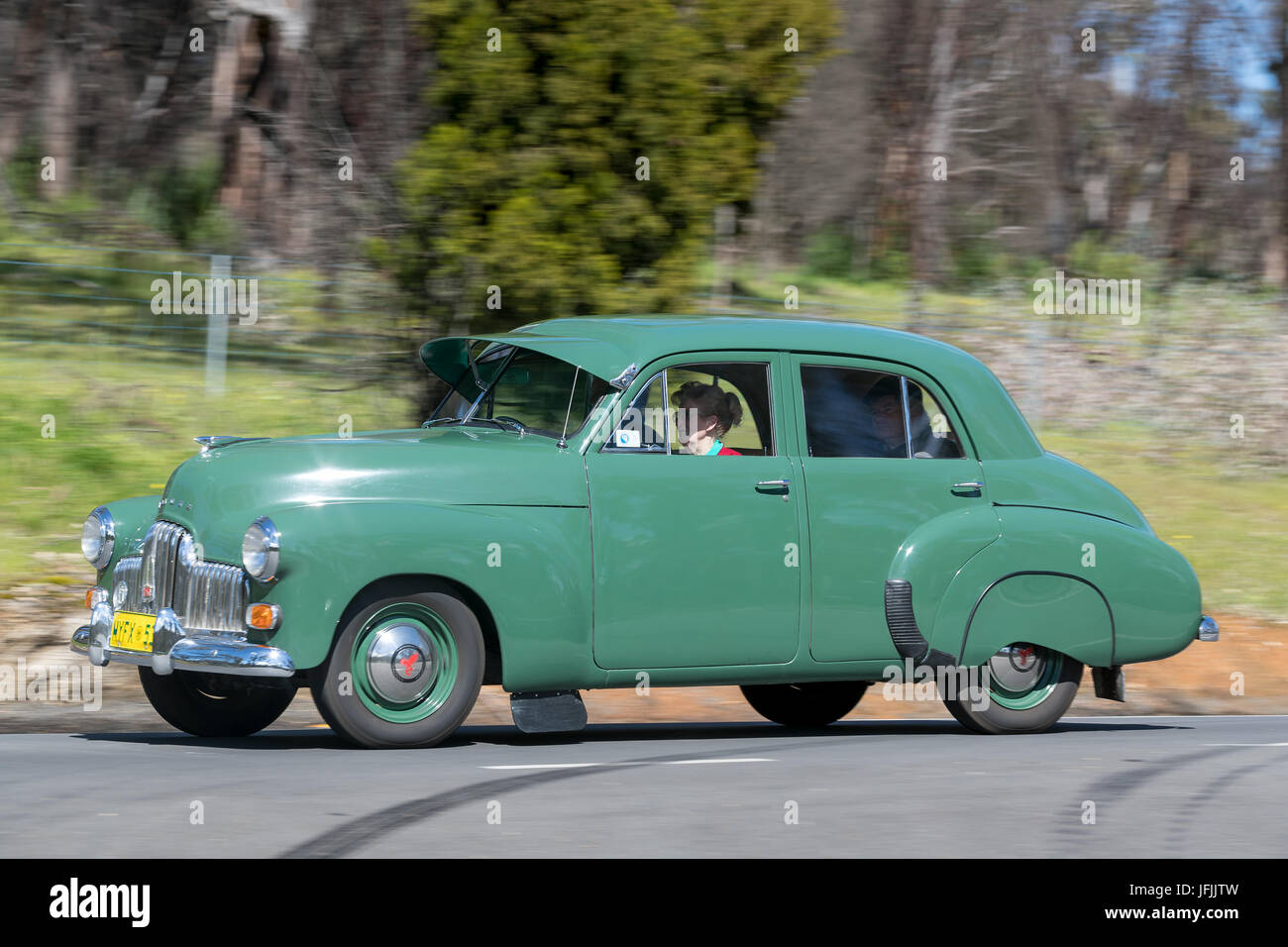 Vintage 1953 Holden FX driving on country roads near the town of Birdwood, South Australia. Stock Photo