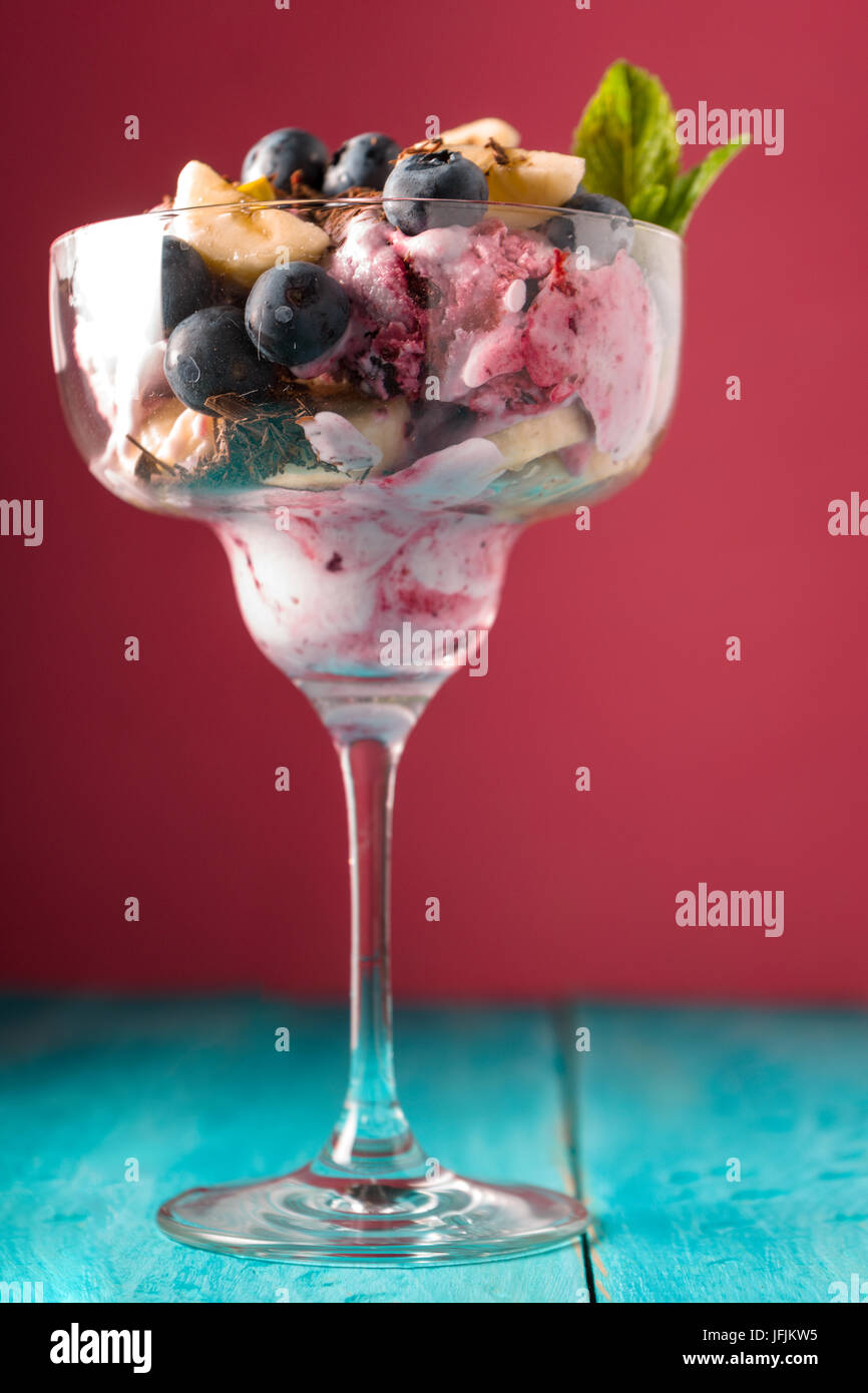 Semifreddo in the glass dessert bowl on the pink blurred background vertical Stock Photo