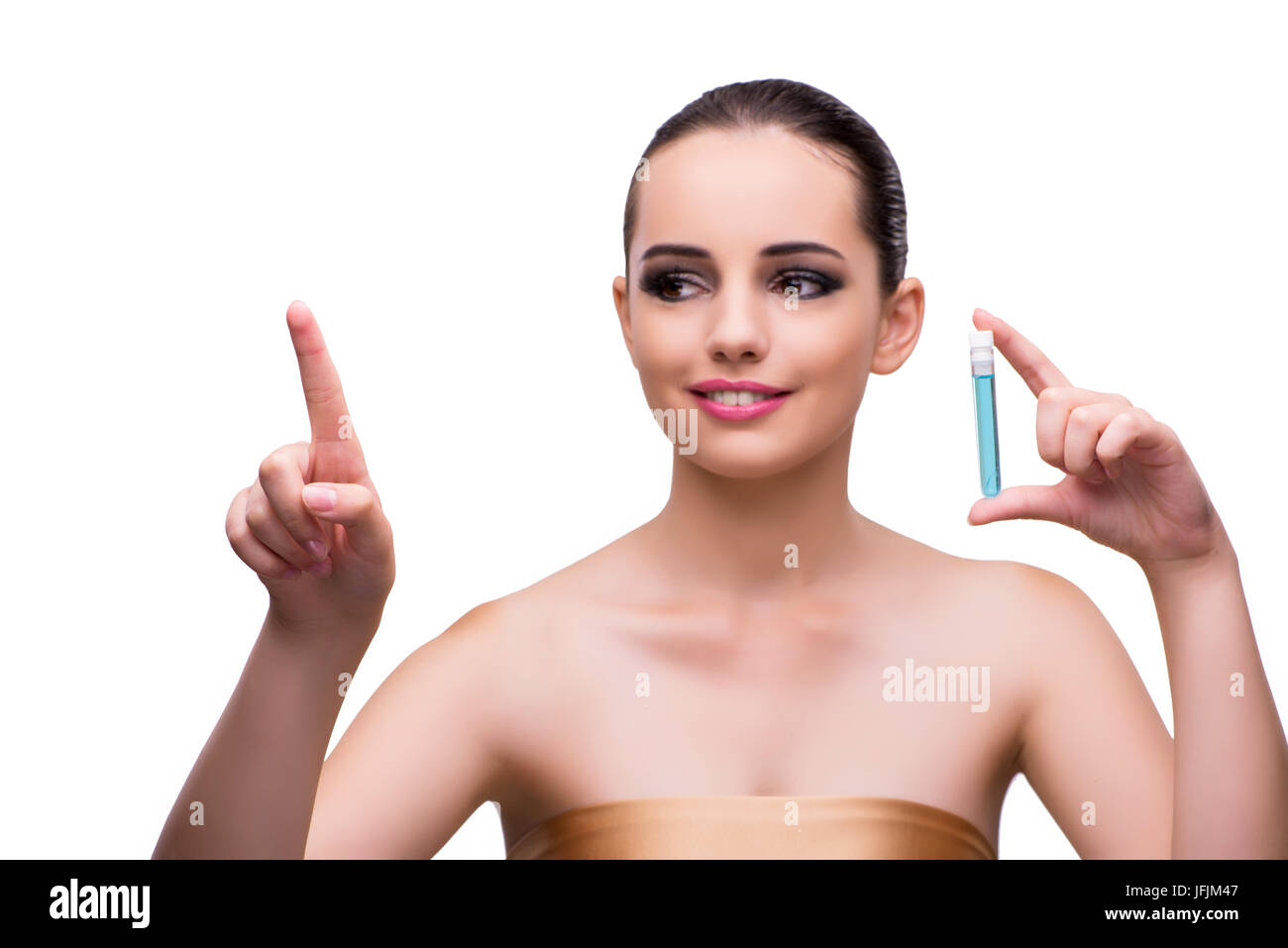 The woman with a bottle of cream isolated on white Stock Photo