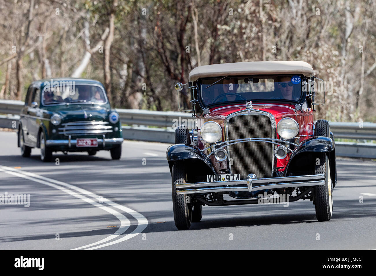 Vintage 1932 Chevrolet Confederate Tourer driving on country roads near the town of Birdwood, South Australia. Stock Photo
