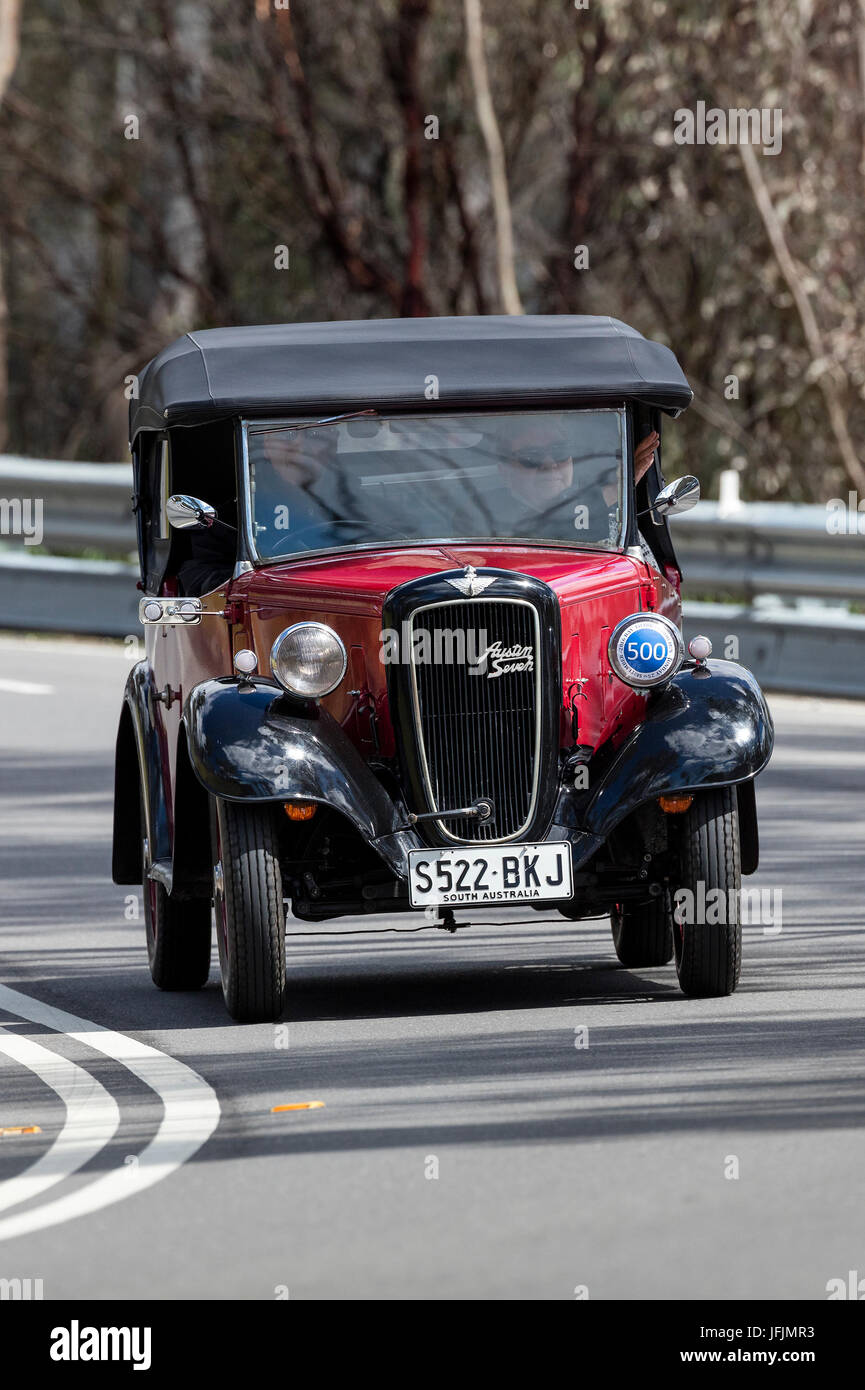 Vintage 1937 Austin 7 Tourer driving on country roads near the town of Birdwood, South Australia. Stock Photo