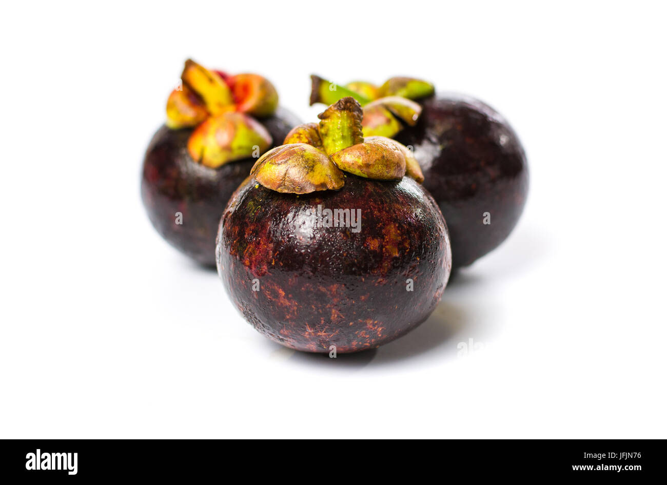 Purple mangosteen tropical fruit isolated on white background Stock Photo