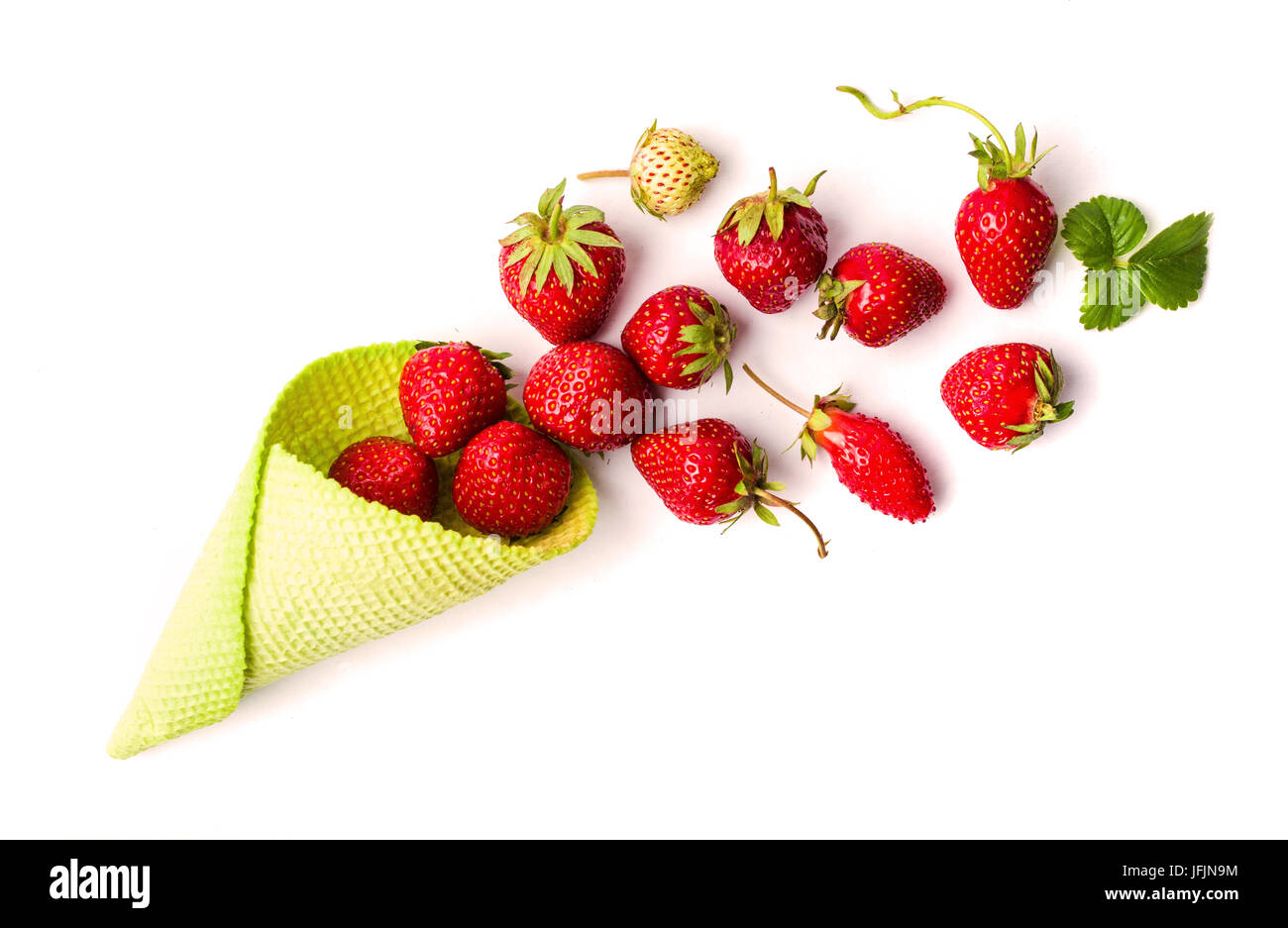 Strawberries in an ice cream cone on white Stock Photo