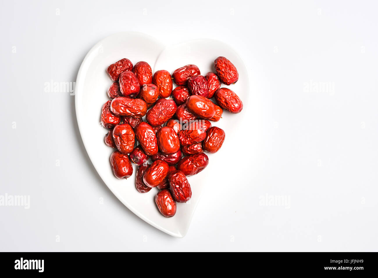 Jujube, Chinese dried red date fruit on a plate Stock Photo