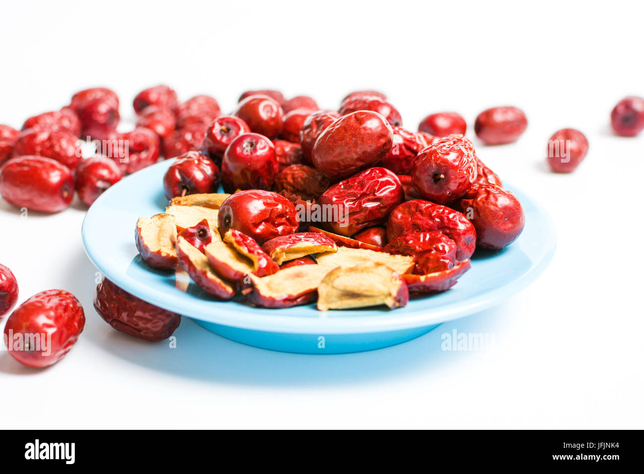 Jujube, Chinese dried red date fruit on a plate isolated Stock Photo