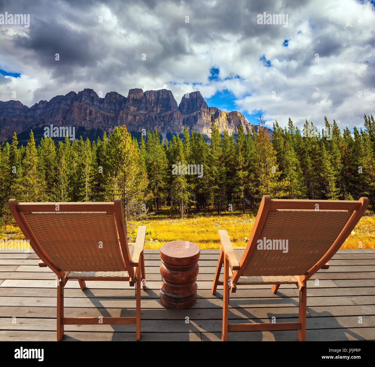 On platform there are two wicker deck chairs Stock Photo - Alamy
