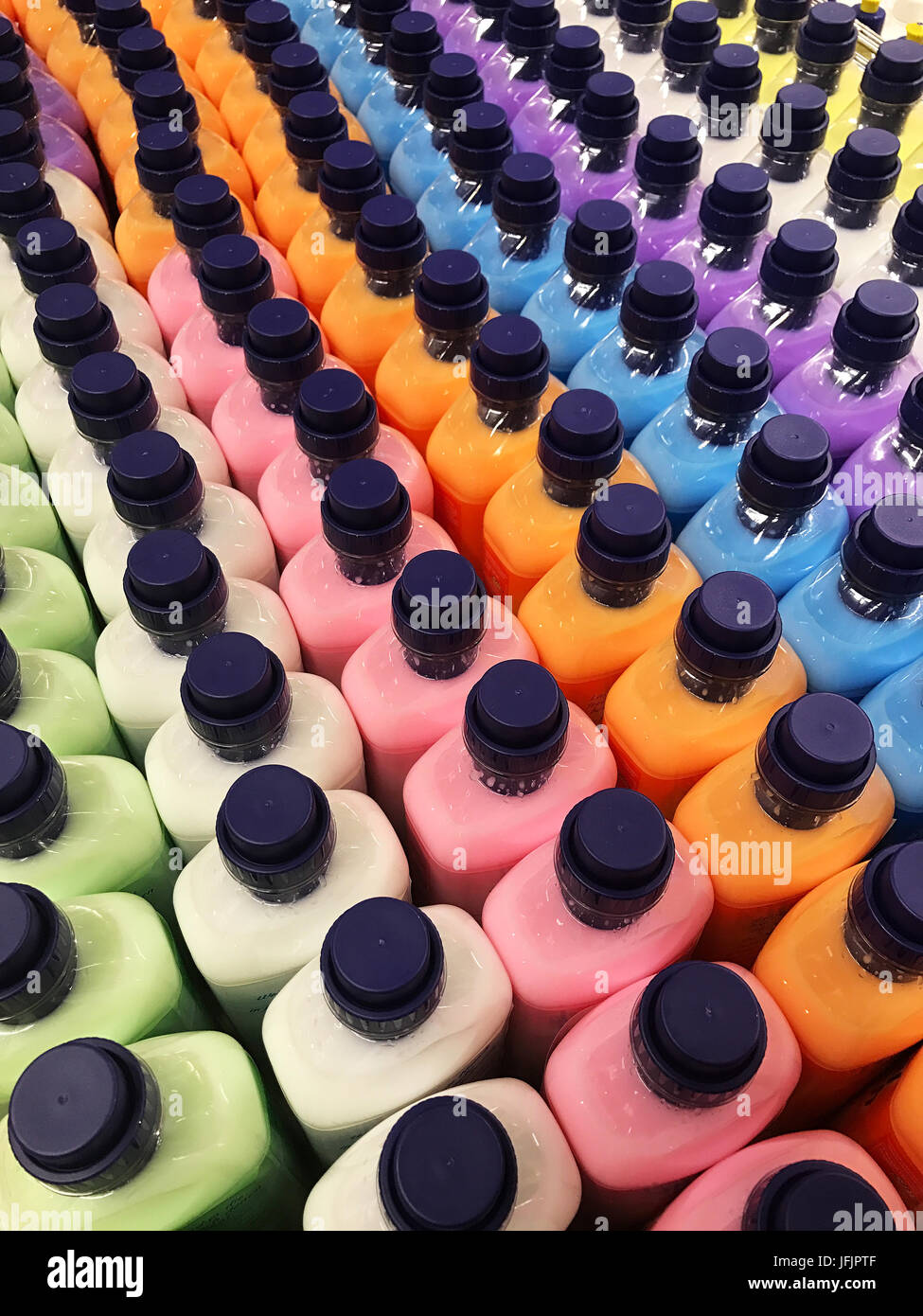 Wash chemical detergent in bright colors for clothes Stock Photo Alamy