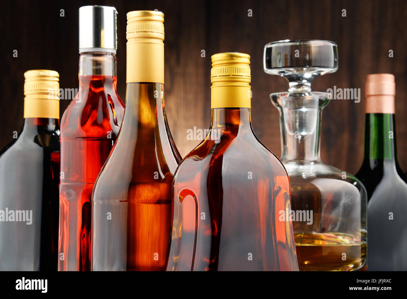 Composition with bottles of assorted alcoholic beverages. Stock Photo