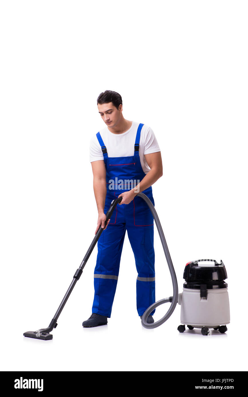 Man in coveralls doing vacuum cleaning on white Stock Photo
