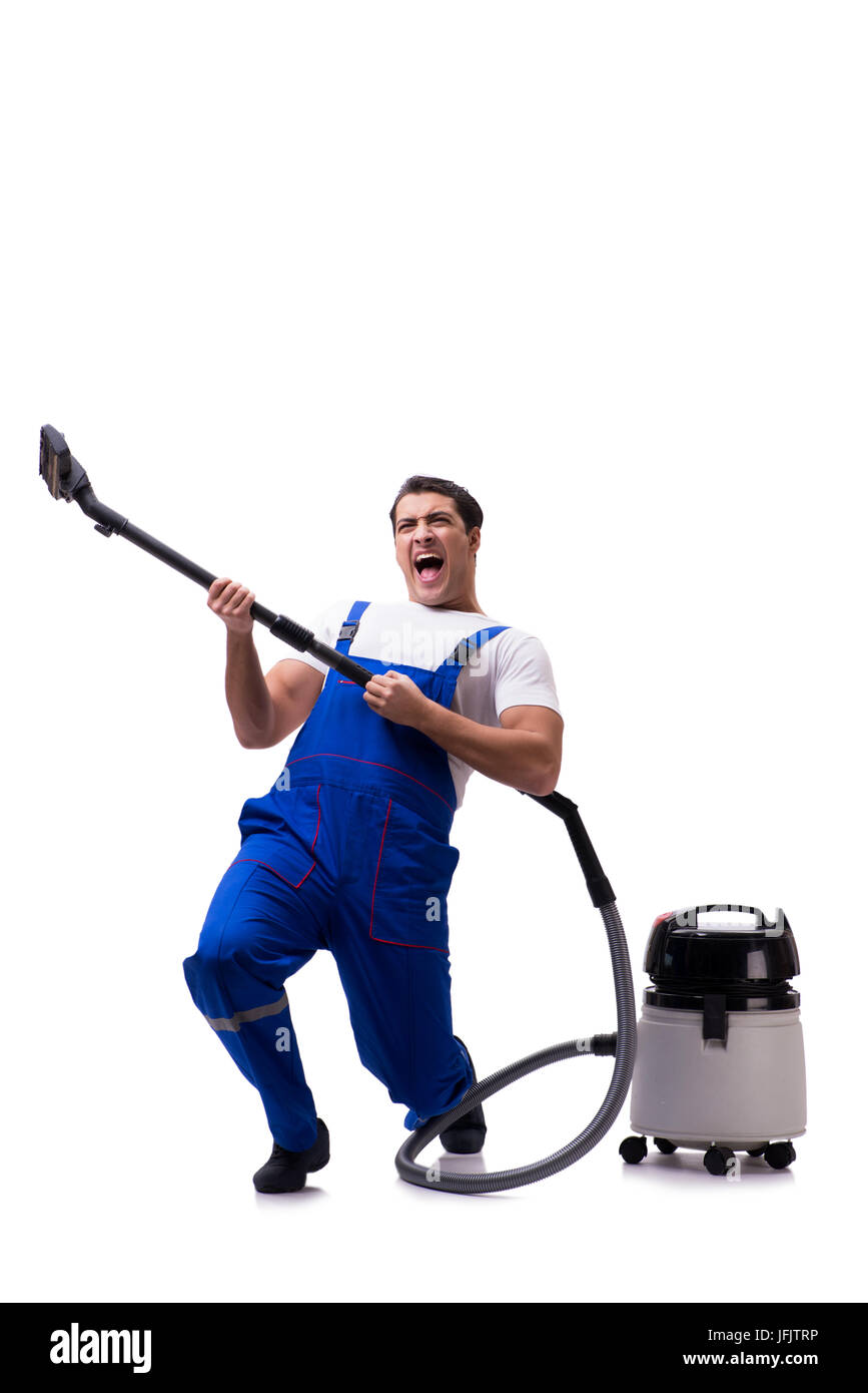 Man in coveralls doing vacuum cleaning on white Stock Photo
