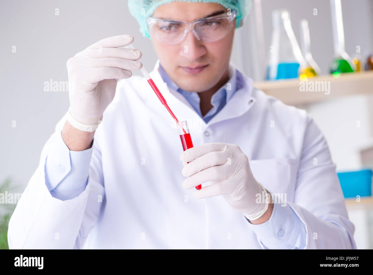 Blood testing in the lab with young scientist Stock Photo Alamy