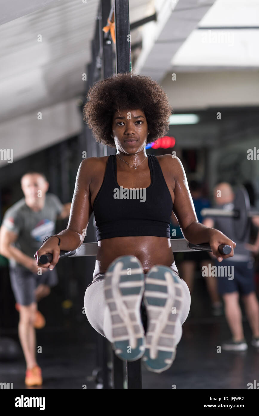 african american athlete woman workout out arms on dips horizontal parallel  bars Exercise training triceps and biceps doing push ups Stock Photo - Alamy