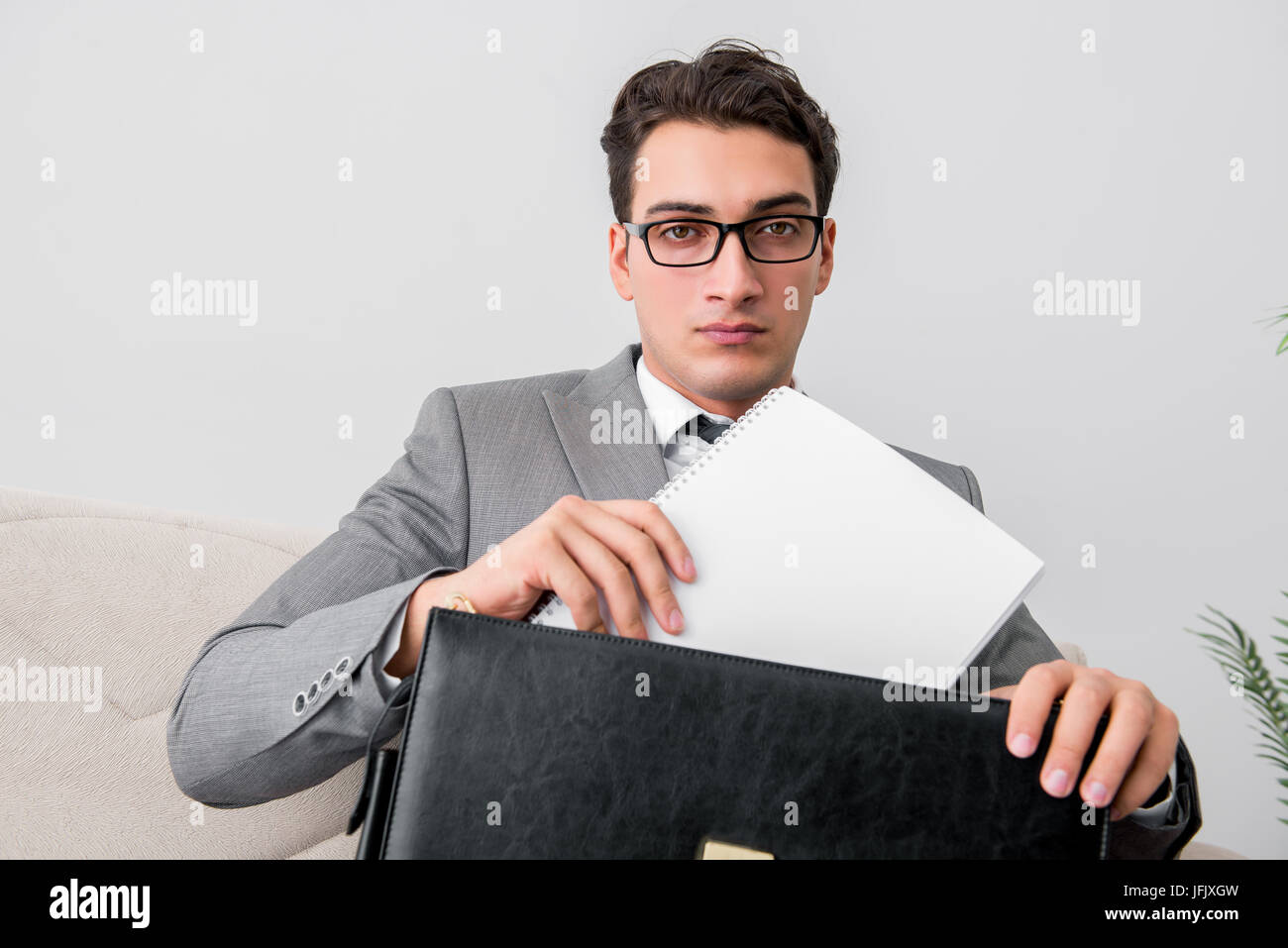 Businessman with briefcase in business concept Stock Photo