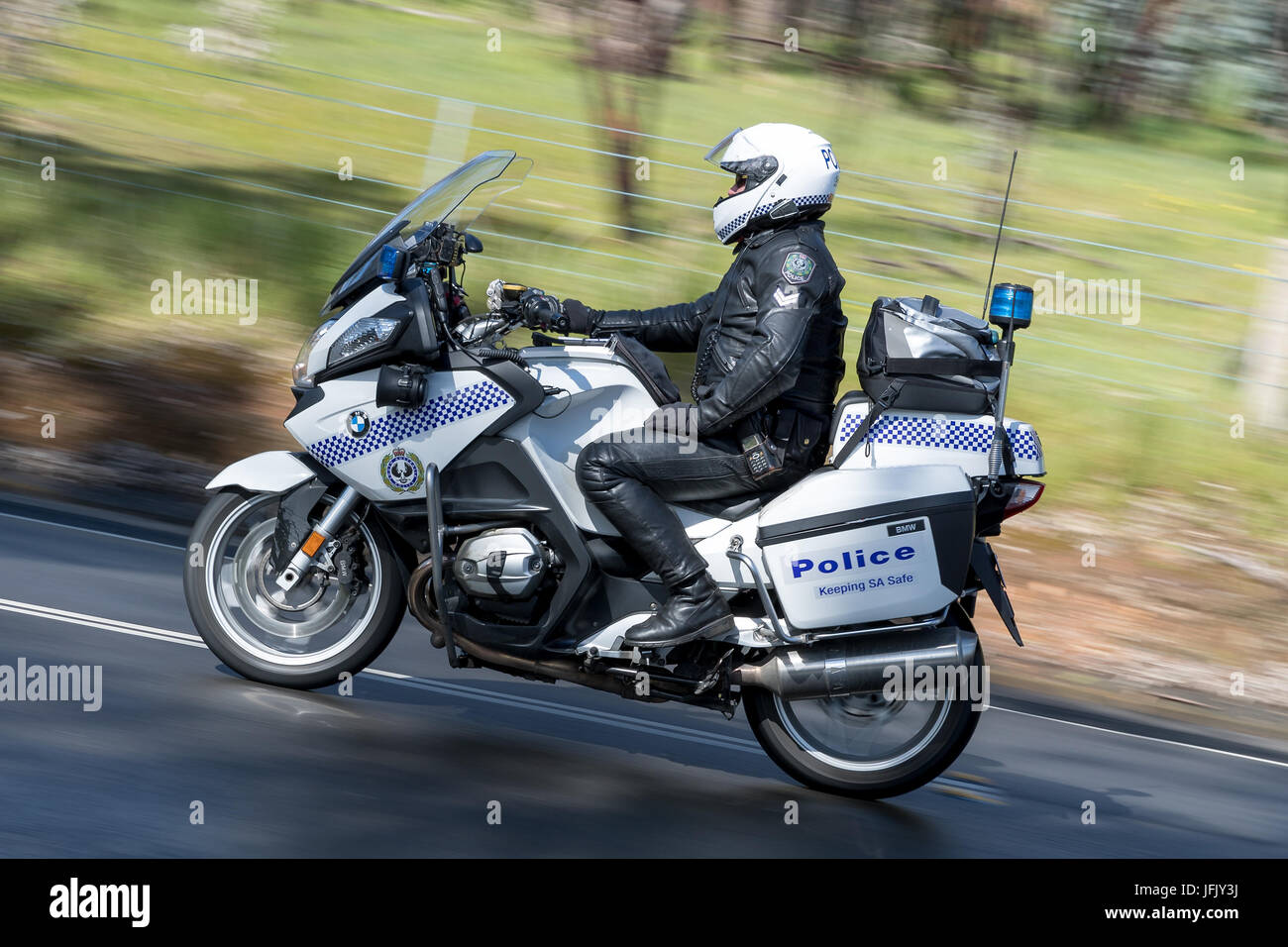 South Australian Police officer riding a BWM Police motorcycle on