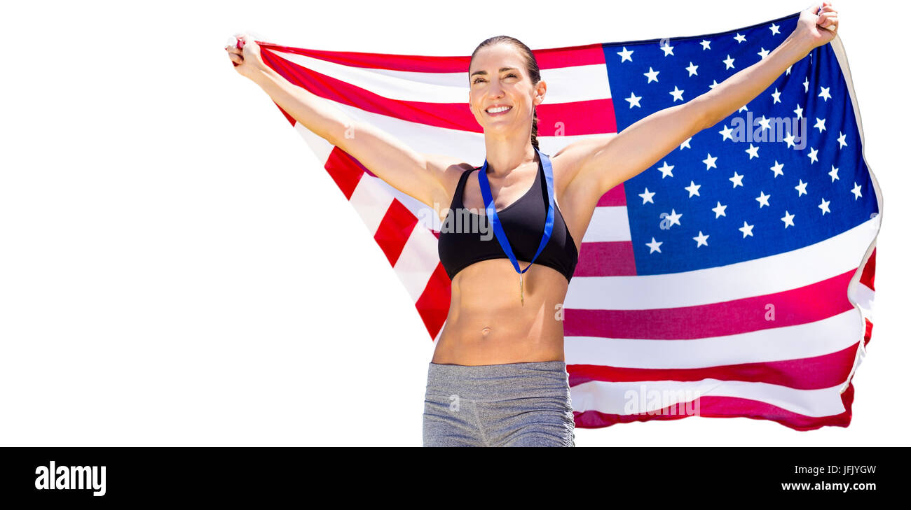 Happy sportswoman posing with an american flag Stock Photo