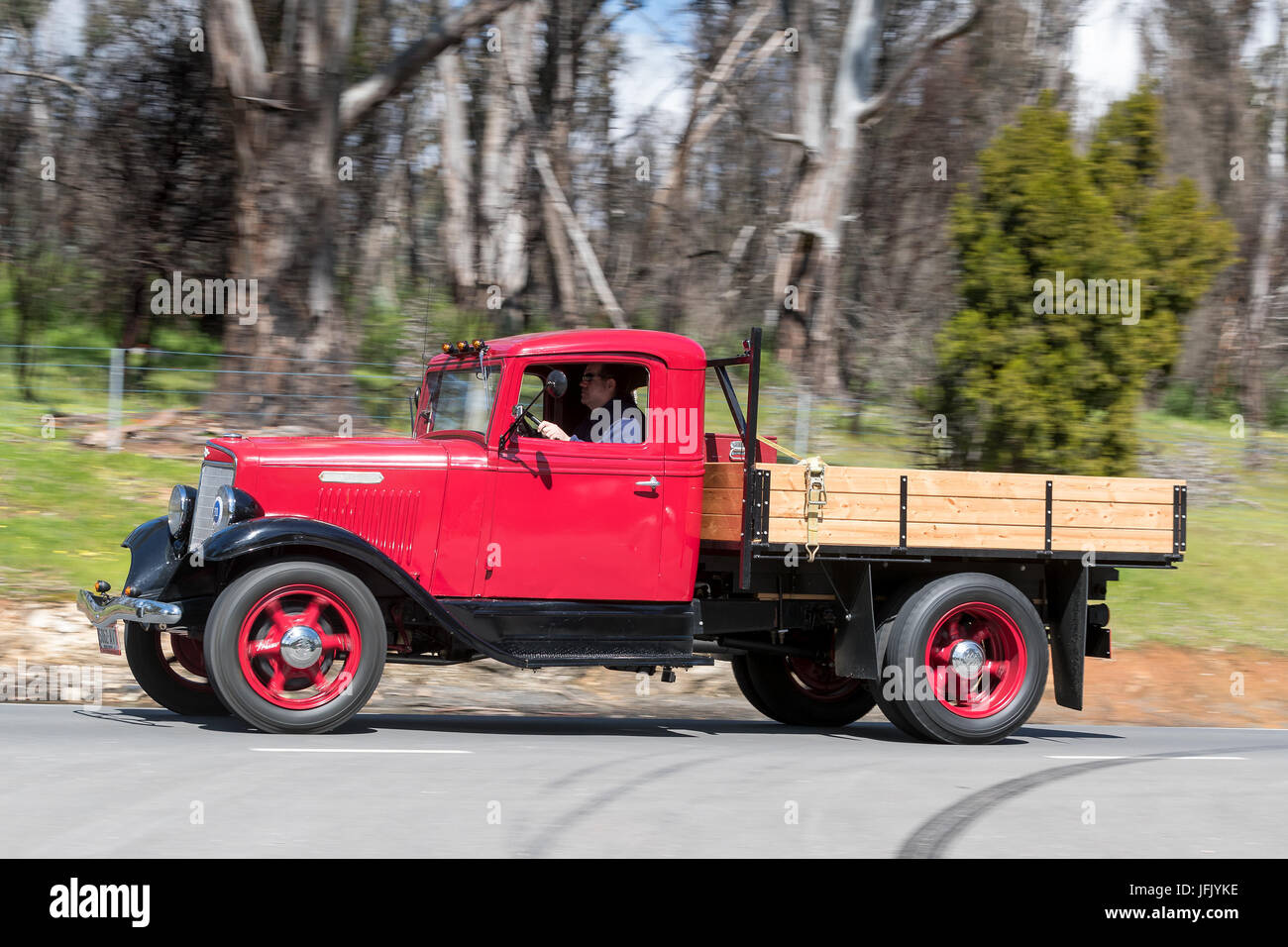 Vintage 1936 International Harvester C-30 Truck driving on country roads near the town of Birdwood, South Australia. Stock Photo