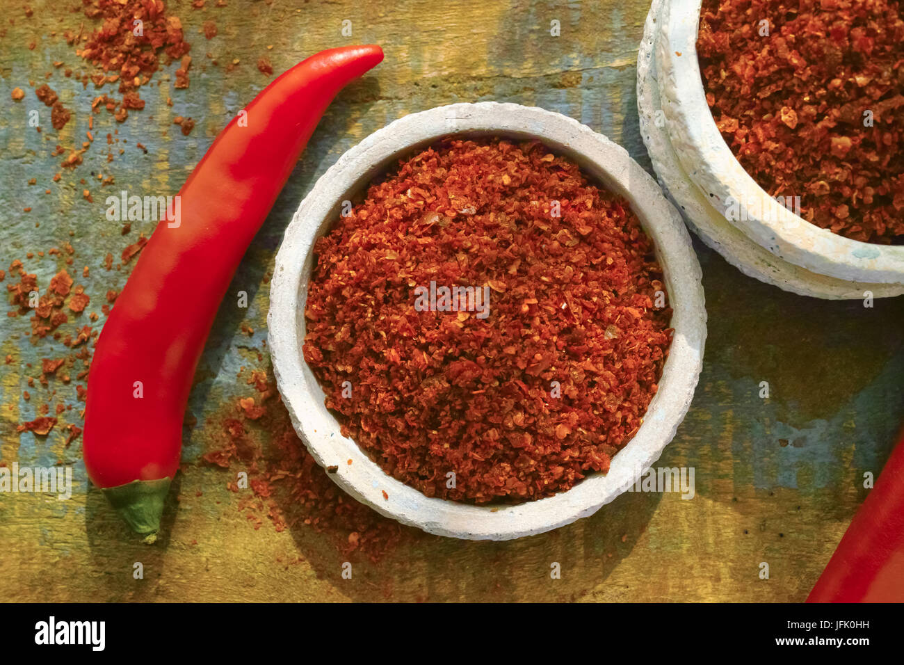 Red hot chili Cayenne pepper fresh and dried powdered spice, ready to