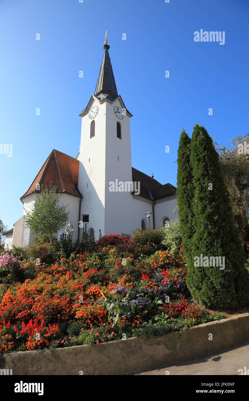 Church built on a hill and surrounded by flowers Stock Photo