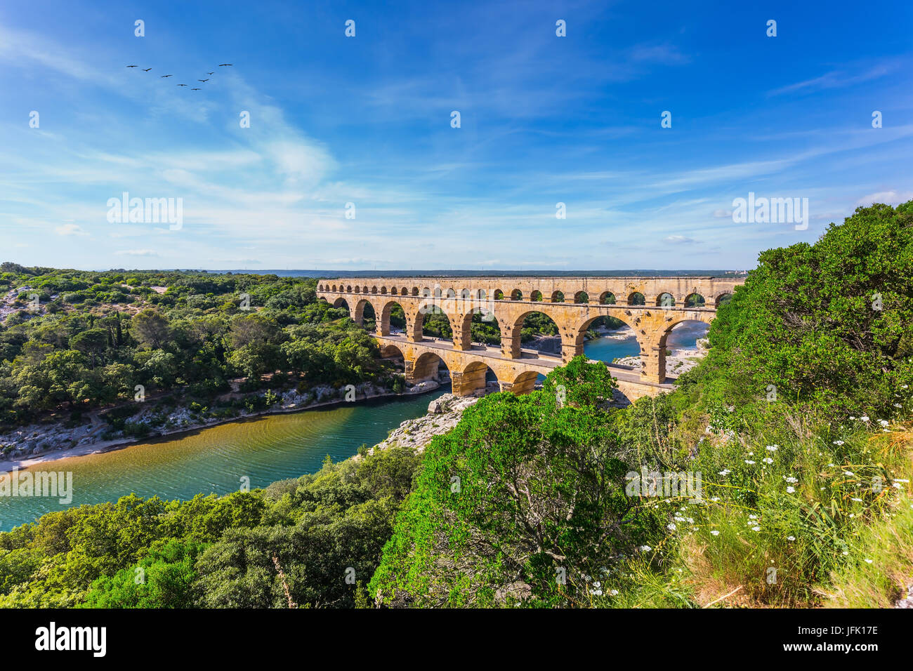Three-tiered aqueduct Pont du Gard and natural park Stock Photo