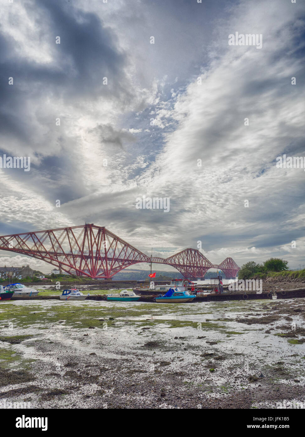 Boats moored in front of the Forth Rail Bridge Stock Photo