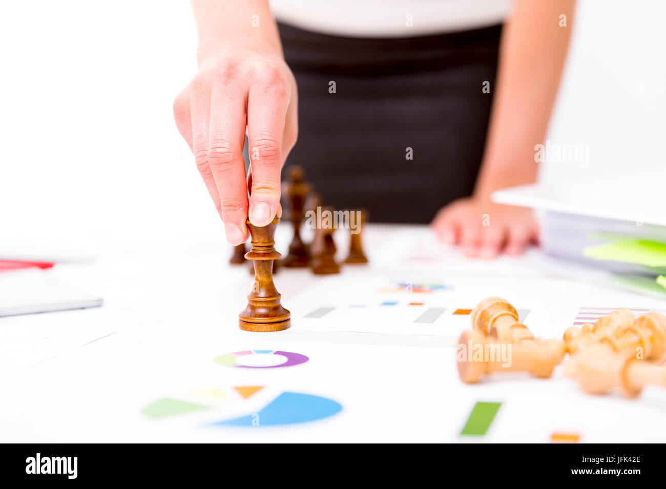 Competition and strategy in business. Business Woman is holding chess piece Stock Photo