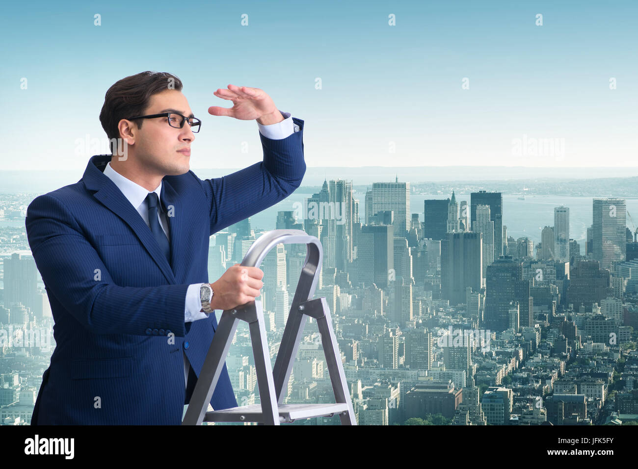 Businessman climbing ladder in business concept Stock Photo - Alamy