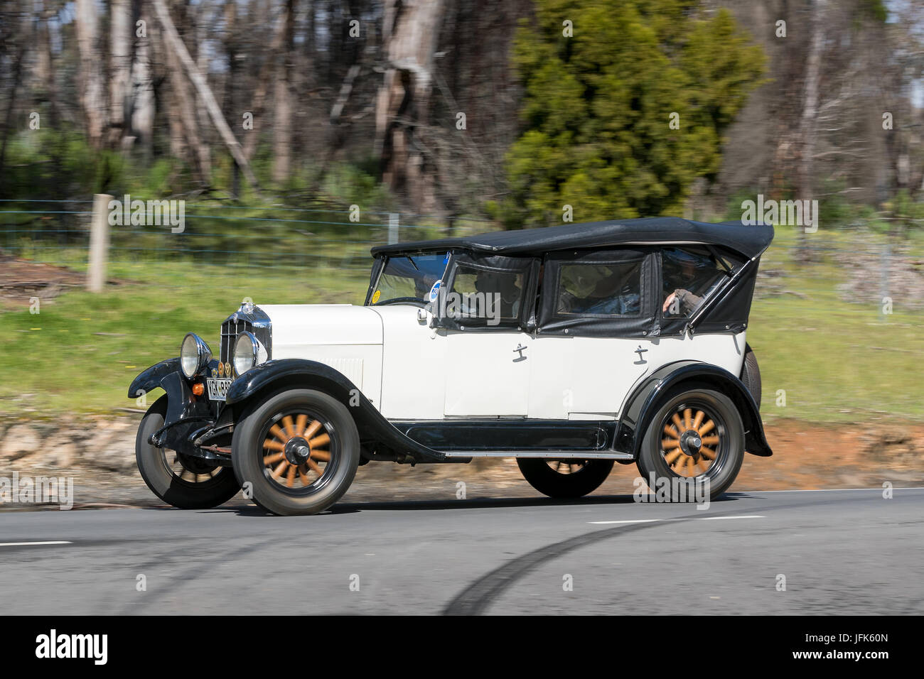 Vintage 1928 Durant Rugby Tourer driving on country roads near the town of Birdwood, South Australia. Stock Photo