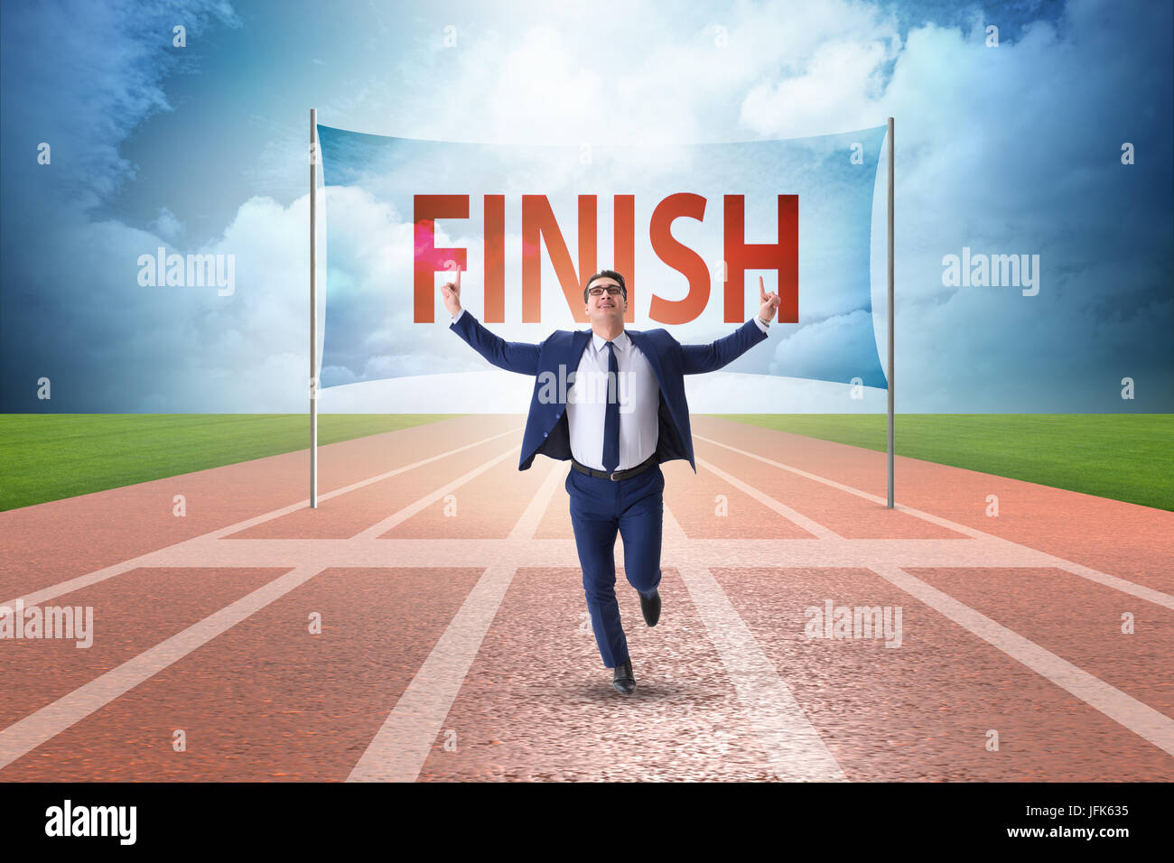 Businessman on the finishing line in competition concept Stock Photo ...