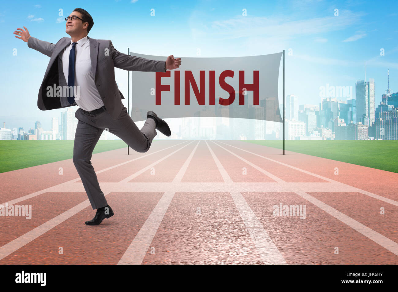Businessman on the finishing line in competition concept Stock Photo ...