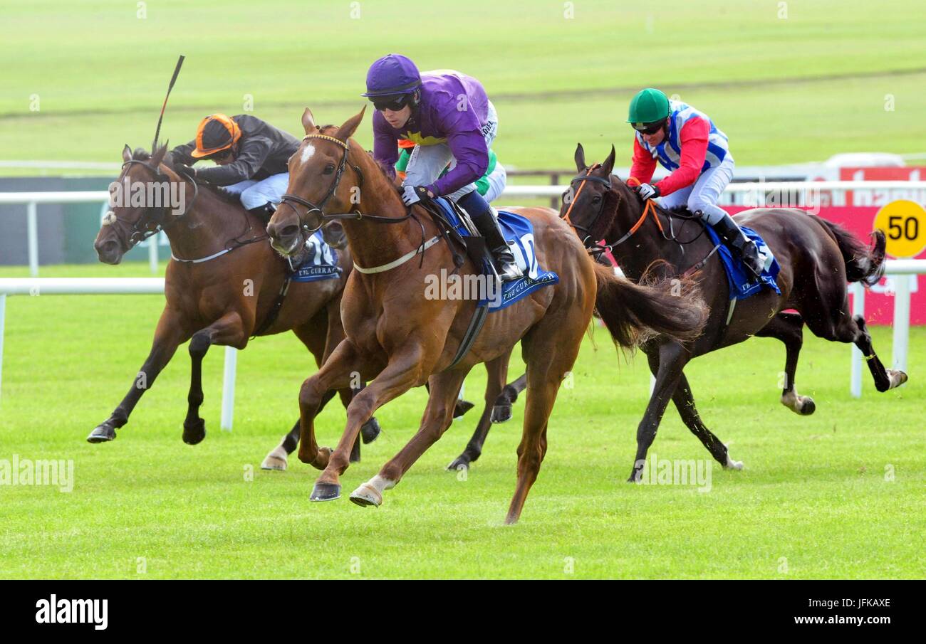 Three Kingdoms ridden by Leigh Roche (centre) before winning the Irish Stallion Farms European Breeders Fund Handicap (60-100) during day two of the Dubai Duty Free Irish Derby Festival at Curragh Racecourse, Co. Kildare. Stock Photo