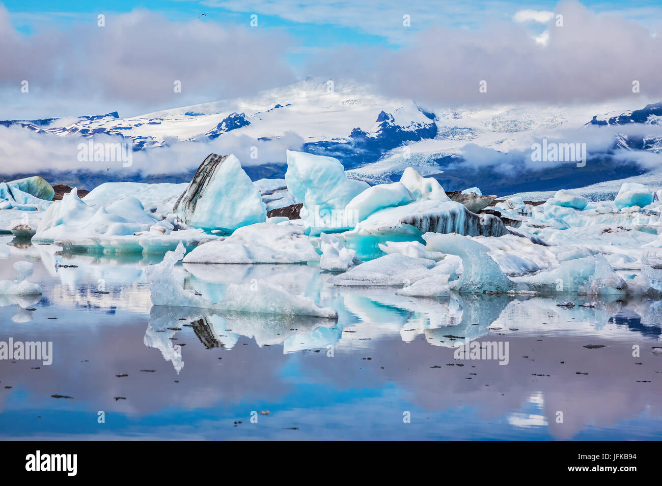 Ice floes are reflected in the mirrored water Stock Photo