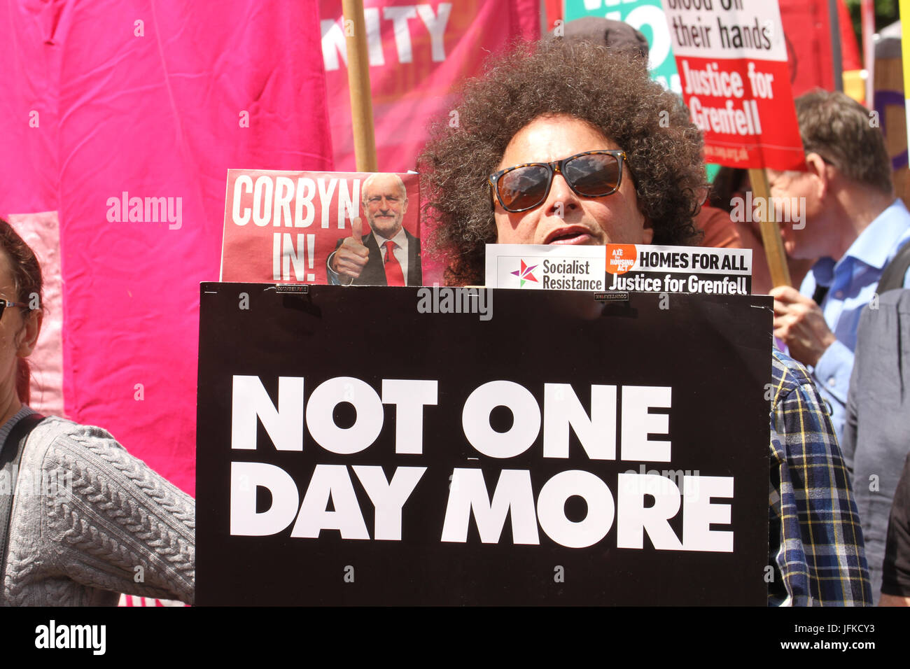 London, UK - 1 July 2017 - A demonstrator hold up a placard witht eh words 'Not One Day More' during the national demonstration demanding for an end of the Tory government on 1 July.The demo began at Portland Place with demonstrators marching to Parliament Square for a rally. Credit: David Mbiyu/Alamy Live News Stock Photo