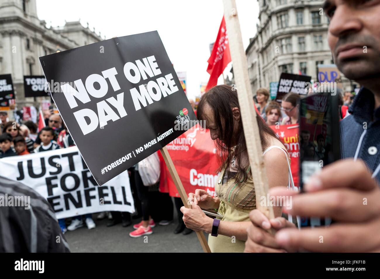 London, UK. 01st July, 2017. LONDON, ENGLAND - JULY 01 Demonstrators for Grenfell Tower joined the 'Not One Day More' rally in Parliement square. Thousands of protesters joined the anti-Tory demonstration at BBC Broadcasting House and marched to Parliament Square. The demonstrators were calling for an end to the Conservative Government and policies of austerity Credit: onebluelight.com/Alamy Live News Credit: onebluelight.com/Alamy Live News Stock Photo