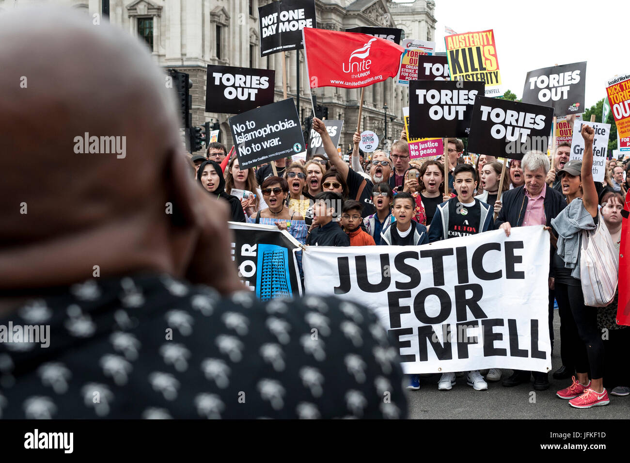 London, UK. 01st July, 2017. LONDON, ENGLAND - JULY 01 Demonstrators for Grenfell Tower joined the 'Not One Day More' rally in Parliement square. Thousands of protesters joined the anti-Tory demonstration at BBC Broadcasting House and marched to Parliament Square. The demonstrators were calling for an end to the Conservative Government and policies of austerity Credit: onebluelight.com/Alamy Live News Credit: onebluelight.com/Alamy Live News Stock Photo