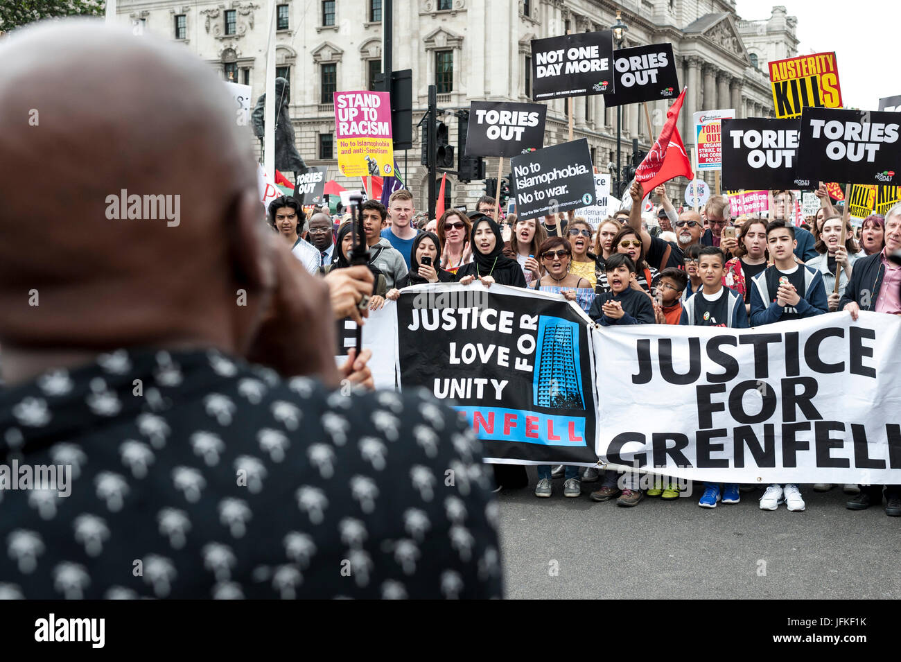 London, UK. 01st July, 2017. LONDON, ENGLAND - JULY 01 Demonstrators for Grenfell Tower joined the 'Not One Day More' rally in Parliement square. Thousands of protesters joined the anti-Tory demonstration at BBC Broadcasting House and marched to Parliament Square. The demonstrators were calling for an end to the Conservative Government and policies of austerity Credit: onebluelight.com/Alamy Live News Credit: onebluelight.com/Alamy Live News Stock Photo