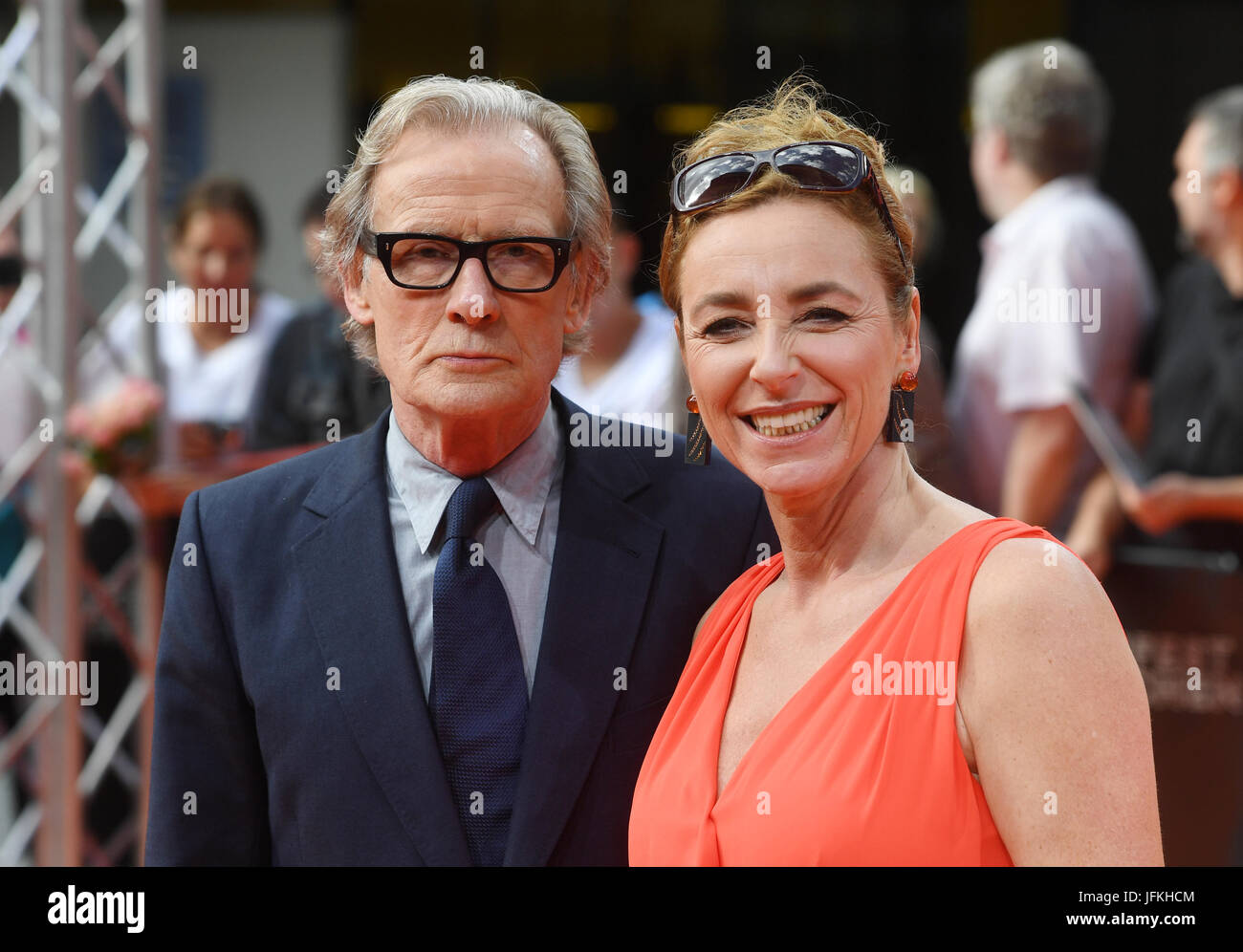 Munich, Germany. 1st July, 2017. The actor Bill Nighy and the director of the film festival, Diana Iljine (R) arrive for the award ceremony and the German premiere of the closing film 'Their Finest' during the Munich Film Festival in Munich, Germany, 1 July 2017. Photo: Tobias Hase/dpa/Alamy Live News Stock Photo