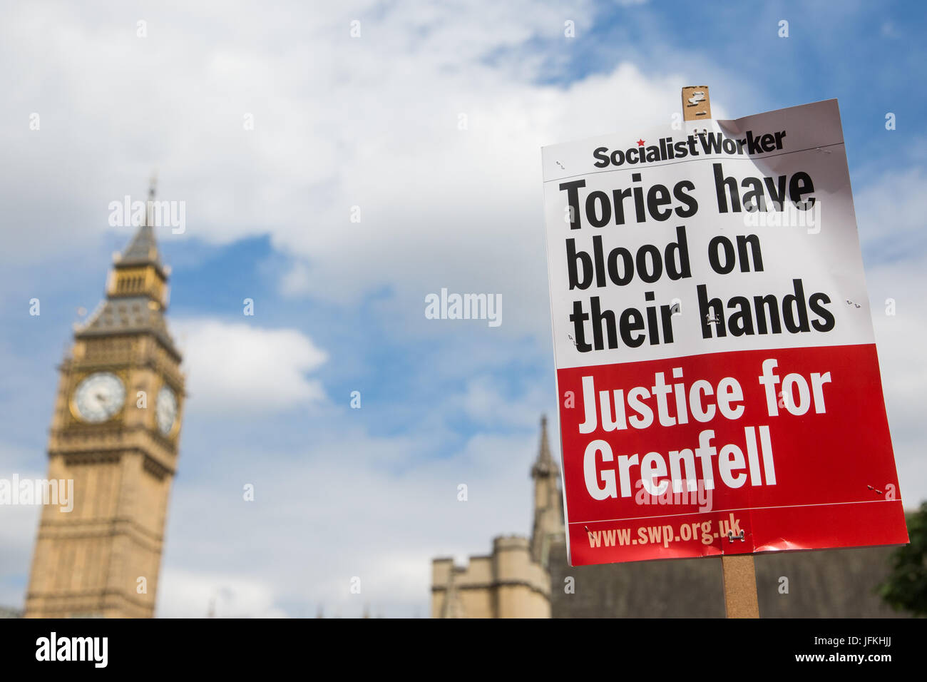 London, UK. 1st July, 2017. A Socialist Worker Justice for Grenfell placard in front of Parliament during the Not One More Day national demonstration organised by the People's Assembly Against Austerity in protest against continuing austerity, cuts and privatisation and to call for a properly funded health service, education system and housing. A minute's silence was also held for the victims of the fire at Grenfell Tower. Credit: Mark Kerrison/Alamy Live News Stock Photo